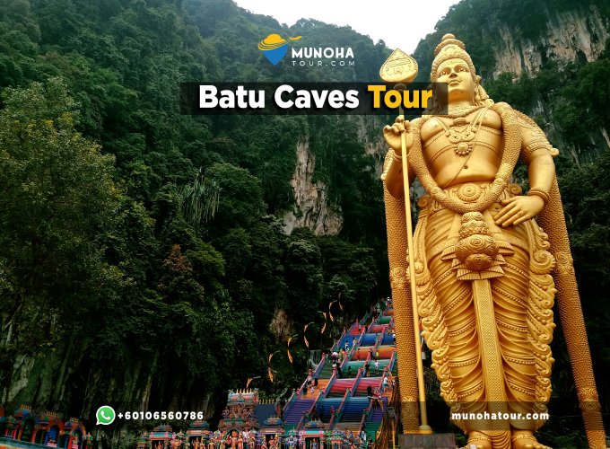 Batu Caves Private Tour, Visitors exploring the iconic during a private tour from Kuala Lumpur Malaysia, with the towering golden statue of Lord Murugan in the background.